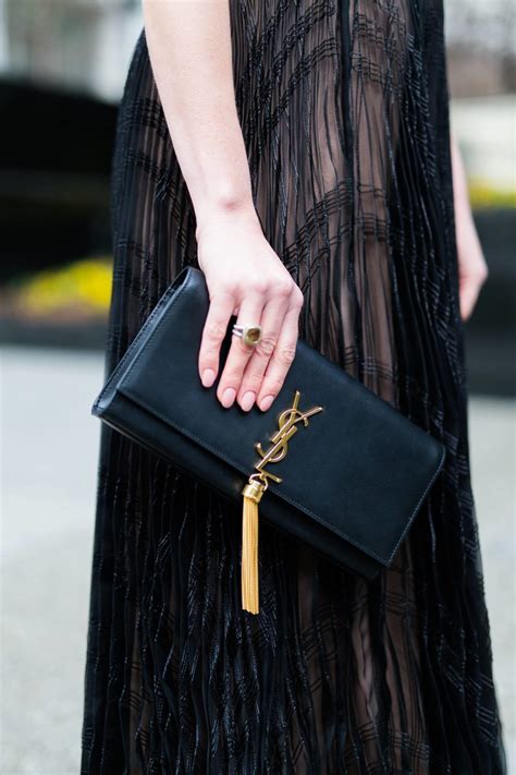 ysl tassel clutch replica|ysl handbag dupe.